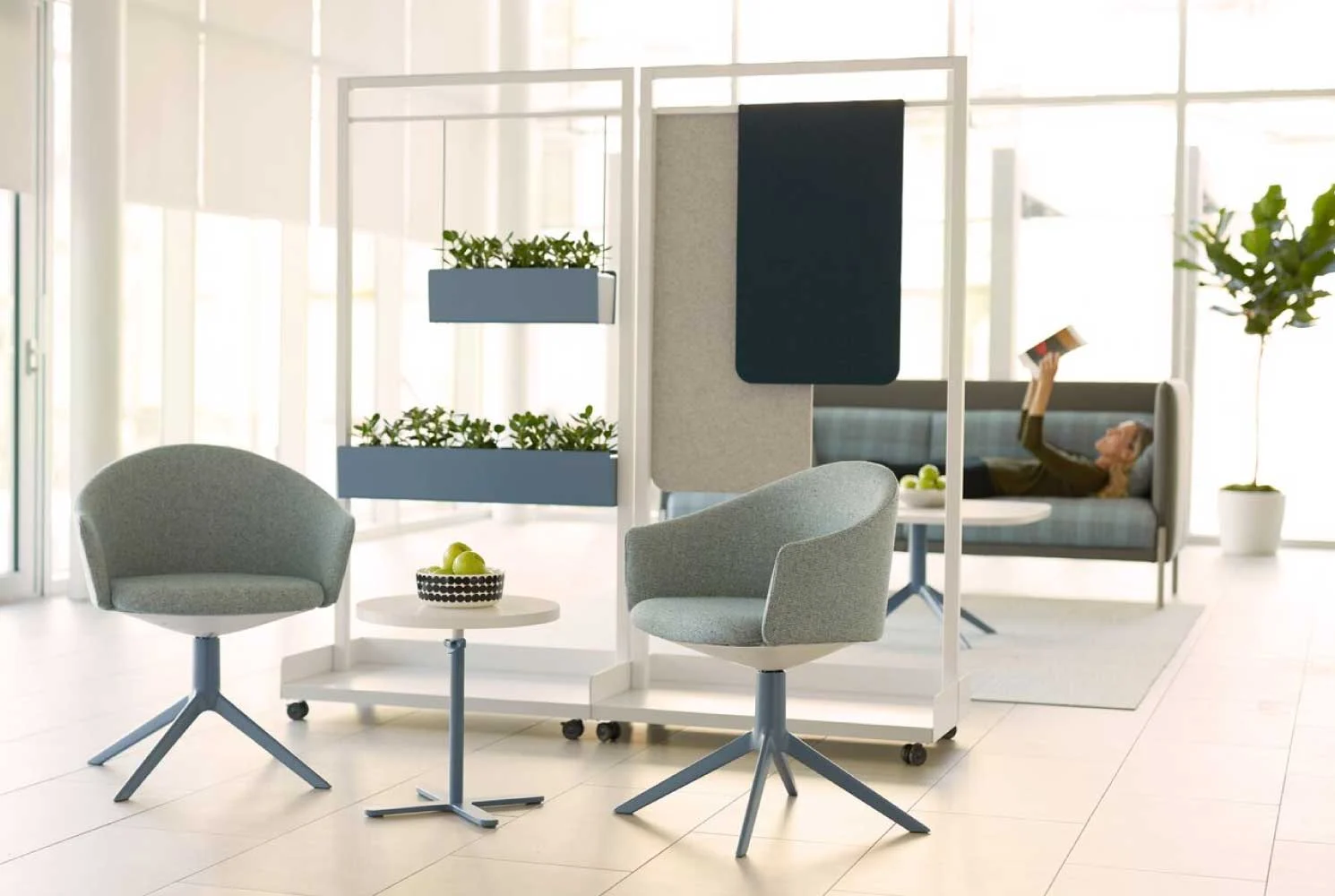 Seating area featuring Teknion Kiosk free-standing, portable modules