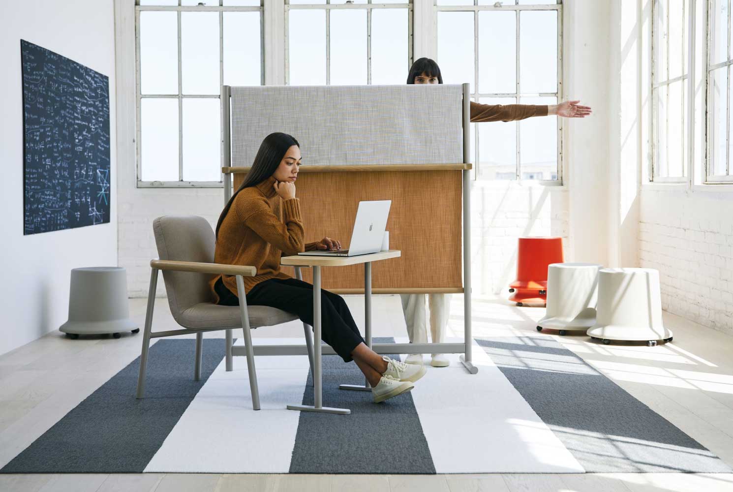Remote workspace featuring Teknion Routes laptop table & Meet n Greet chair